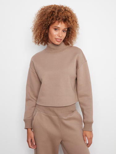 The outfit showcases a stylish drop shoulder design, adding a relaxed touch to the look by Charlie B.
