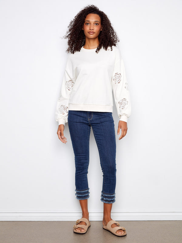 Chic long-sleeved sweater with unique inserted sleeve embroidery adding a touch of elegance to your wardrobe by Charlie B.
