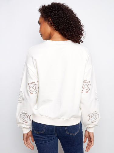 Beautifully crafted sweater with intricate sleeve embroidery, offering a blend of style and comfort by Charlie B.