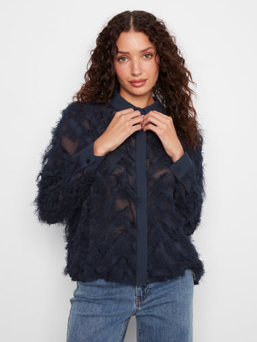 Stylish button-front navy blouse with fringed chiffon detailing, adding a touch of sophistication to any outfit. By Charlie B.