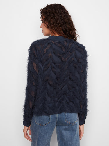 Chic navy blouse with a unique button-front design, offering both style and versatility for any occasion. By Charlie B.