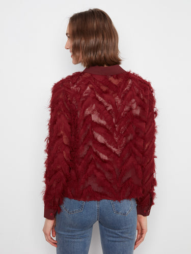 Sophisticated merlot blouse designed with a classic shirt collar and fringe detail by Charlie B.