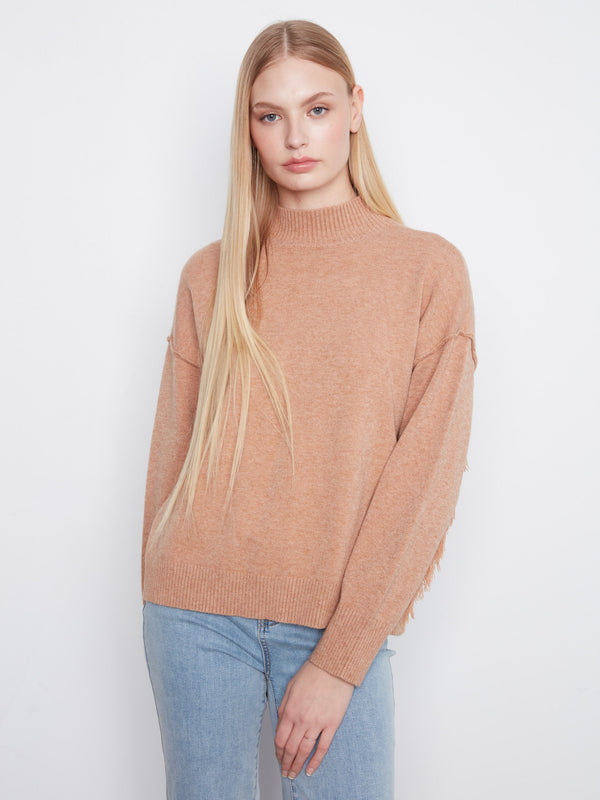 Cozy sweater with a stylish mock neck, perfect for chilly days. The warm hue adds a touch of elegance to any outfit by Charlie B.