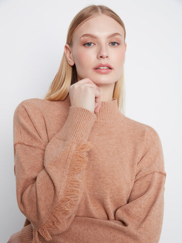 Chic sweater featuring fringe detail along the sleeves, adding a playful twist to your casual look by Charlie B.