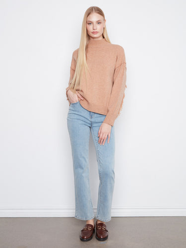 Stylish mock neck design elevates this cozy sweater, making it an ideal choice for both casual and dressy occasions by Charlie B.