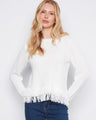 White sweater with a crew neck, featuring a stylish fringed hem for added flair. Perfect for casual outings. By Charlie B.