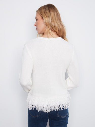 Stylish white top with long sleeves, highlighted by its eye-catching fringed hem that adds movement. By Charlie B.