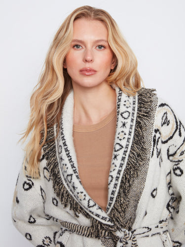 Intricate patterns adorn the shawl collar, enhancing the visual appeal of this chic and cozy cardigan design. By Charlie B.