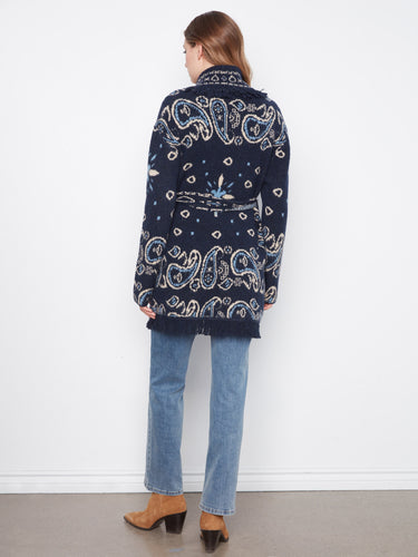 Navy belted cardigan adorned with fringe accents and geometric patterns. Includes handy patch pockets for extra flair by Charlie B.