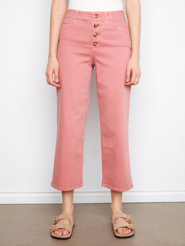 Designed with five pockets and front buttons, these pants offer both functionality and style. Crafted by Charlie B.