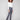 Grey bootcut jeans featuring a stylish front tulip hem, crafted in stretch denim for comfort and flexibility by Charlie B.