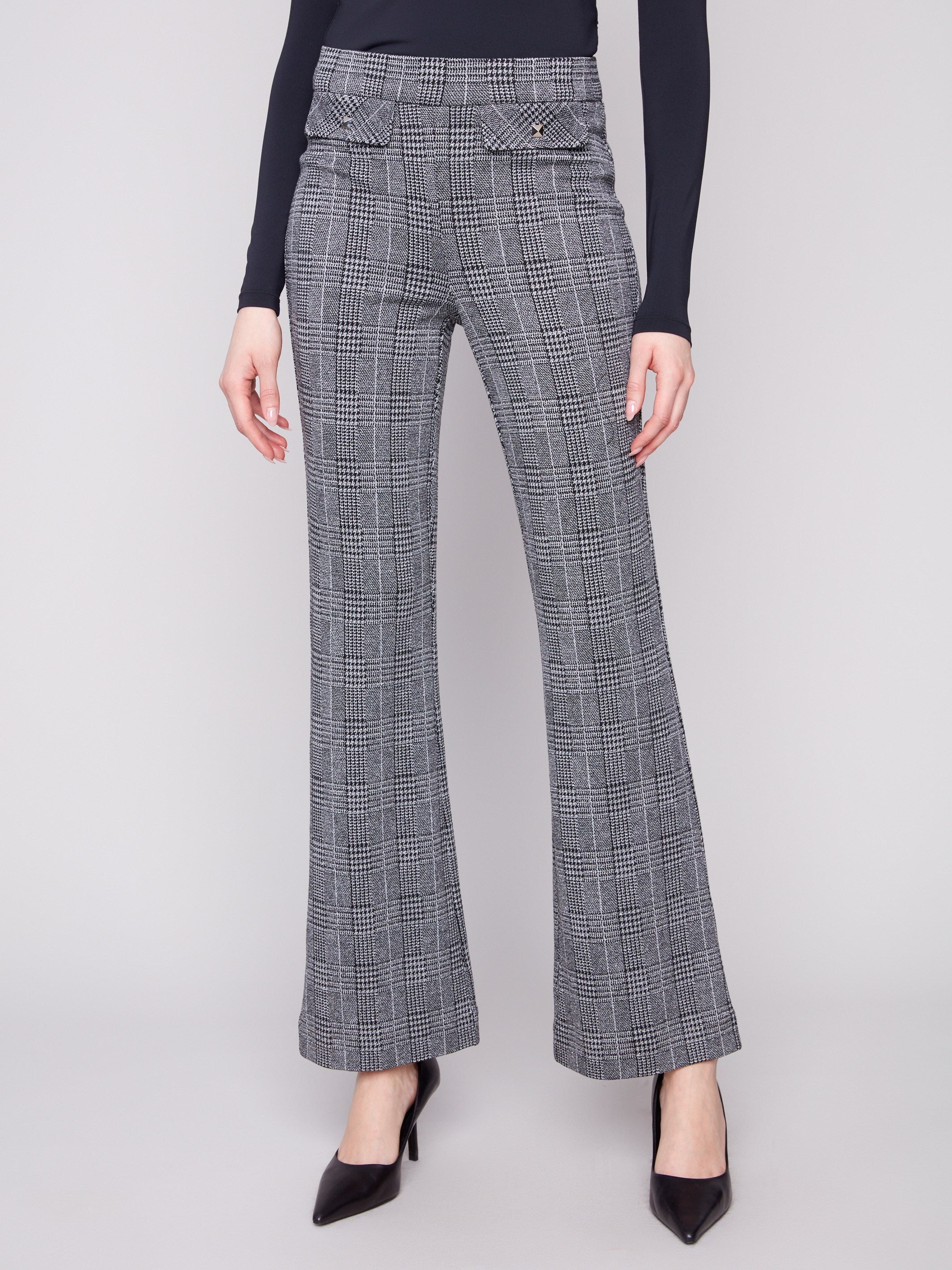 Featuring faux studded flap pockets, these charcoal glen plaid flare pants offer both style and practicality by Charlie B.
