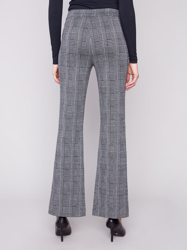 Crafted from stretch fabric, these charcoal glen plaid flare pants ensure comfort without compromising on style by Charlie B.