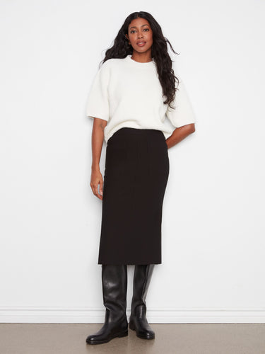 This skirt features a straight fit, offering a sleek silhouette perfect for any occasion. By Charlie B.