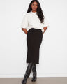 Designed with patch pockets, this midi skirt combines functionality with elegance. By Charlie B.