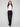 Chic black pants in stretch crepe fabric styled with a crisp white top, by Charlie B.
