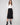 Black crepe skirt with a chic midi length, perfect for versatile styling by Charlie B.