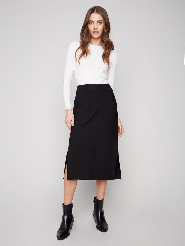 Black crepe skirt with a chic midi length, perfect for versatile styling by Charlie B.