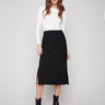 Black crepe skirt with a chic midi length, perfect for versatile styling by Charlie B.