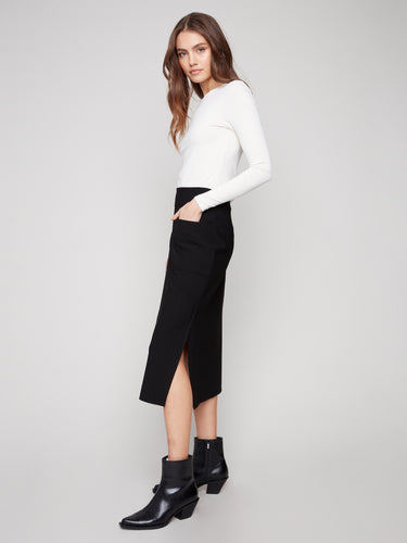 Stylish black crepe skirt with practical front patch pockets, blending fashion and function by Charlie B.