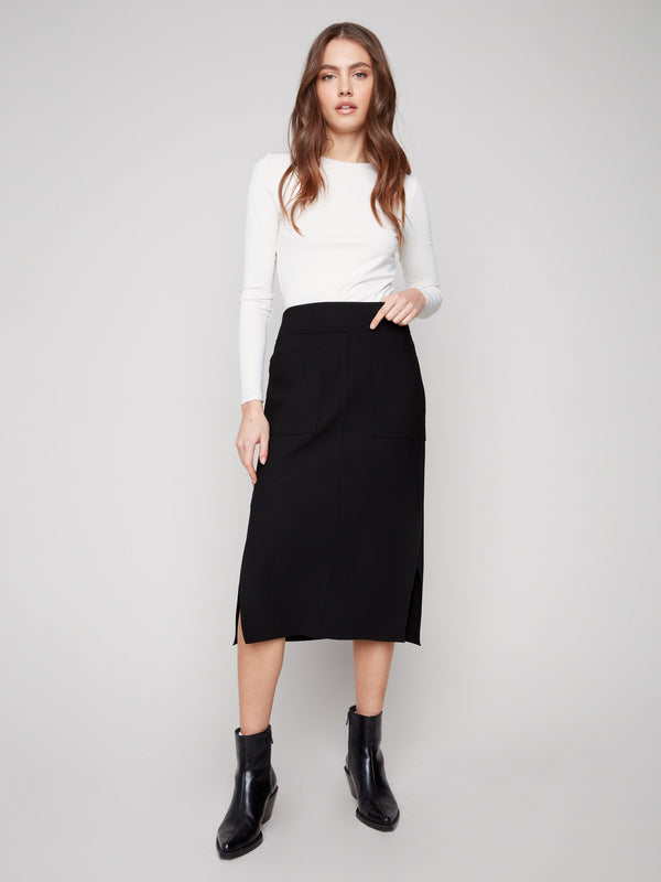 Sophisticated midi length black crepe skirt offering a polished look for any occasion by Charlie B.