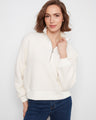 Soft fleece fabric sweater with a stand collar and half-zip closure, offering cozy comfort and style by Charlie B.