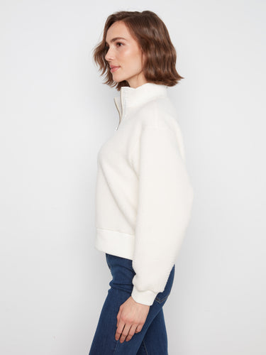 This stylish sweater includes a half-zip closure for adjustable warmth, crafted from soft fleece fabric by Charlie B.