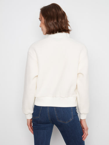 Designed with ribbed cuffs and hem, this relaxed fit sweater ensures both comfort and chic appeal by Charlie B.