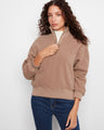 Taupe fleece pullover featuring a relaxed fit and ribbed hem, perfect for cozy days by Charlie B.