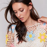 Handcrafted V-neck top with vibrant floral details by Charlie B.