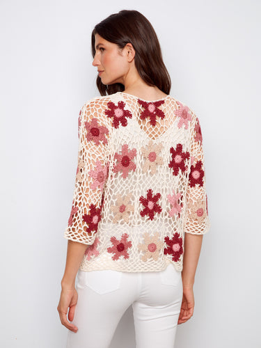 Beautifully designed crochet top in vibrant florals with an elegant crew neckline for timeless style by Charlie B.