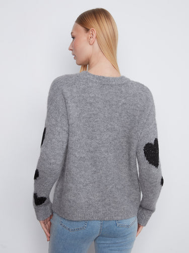 This chic grey sweater features a delightful combination of heart embroidery and comfort by Charlie B.