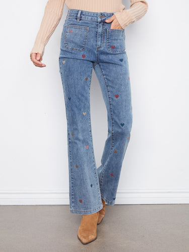 Stylish patch pockets accent these denim jeans, offering both functionality and flair for everyday wear. By Charlie B.