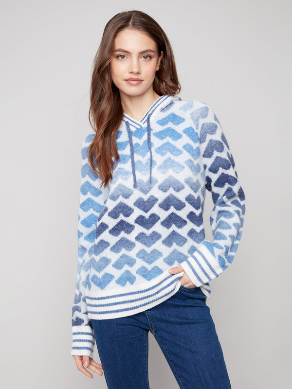 Sweater with blue heart pattern and drawstring hood, perfect for cozy days by Charlie B.