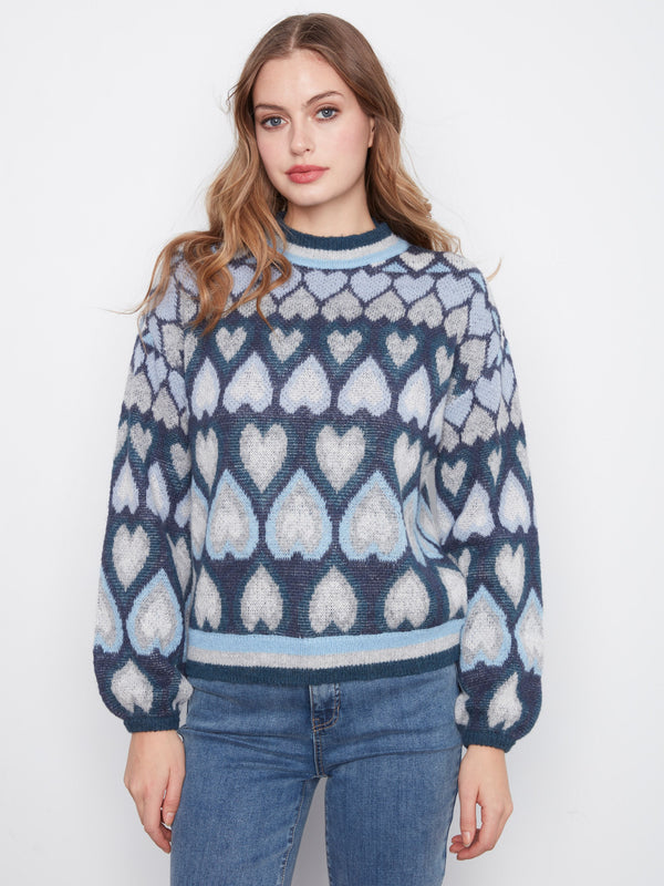 Navy sweater featuring a mock neck and charming heart jacquard design, perfect for cozy days by Charlie B.