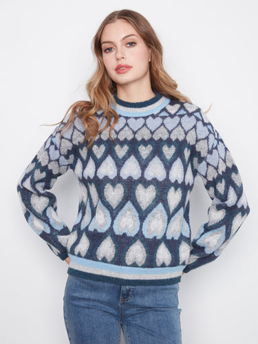 Stylish navy sweater showcasing a drop shoulder design and intricate heart pattern for added flair by Charlie B.