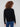 Ribbed shoulders add texture and detail to this elegant black sweater with a white heart by Charlie B.