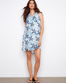 Floral dress featuring a stylish Henley neckline and vibrant blue pattern, perfect for any casual outing. By Charlie B.