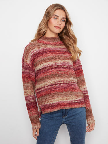 This soft and cozy striped sweater is designed with attention to detail, ensuring warmth and style all season long by Charlie B.