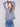 Long-sleeve denim sweater with elegant hem slit and cozy cable knit texture by Charlie B.