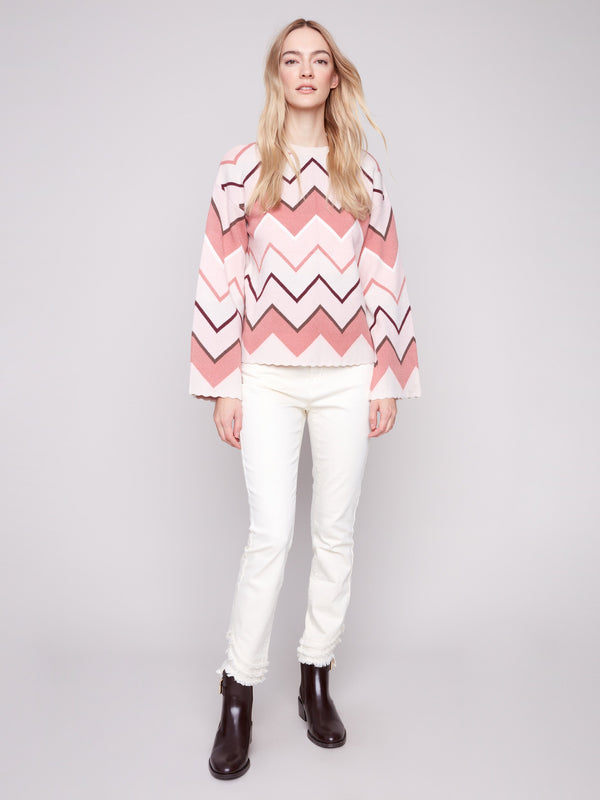 The bell sleeves on this chevron patterned sweater provide a modern twist to a timeless style by Charlie B.