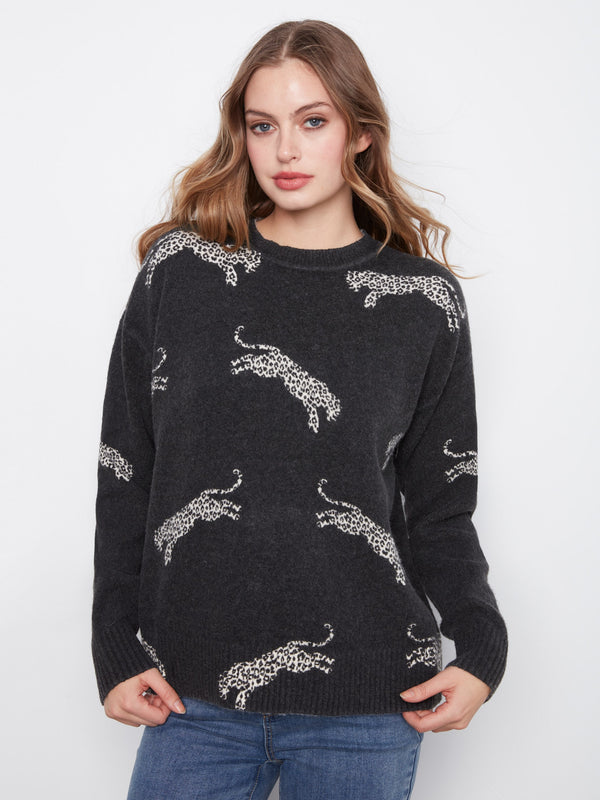Black sweater with wildcat pattern, featuring ribbed cuffs and hem for a snug fit by Charlie B.