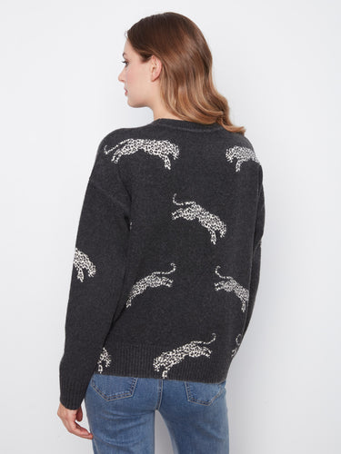 Elegant zebra-patterned jacquard sweater crafted with ribbed cuffs for comfort by Charlie B.