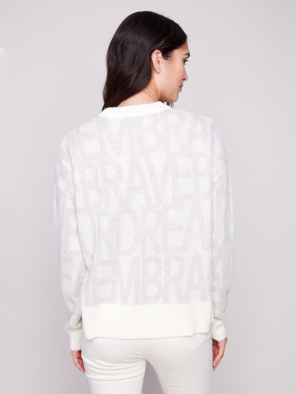 Stylish off-white jacquard sweater highlighted by its subtle tonal text pattern and ribbed cuffs for comfort by Charlie B.