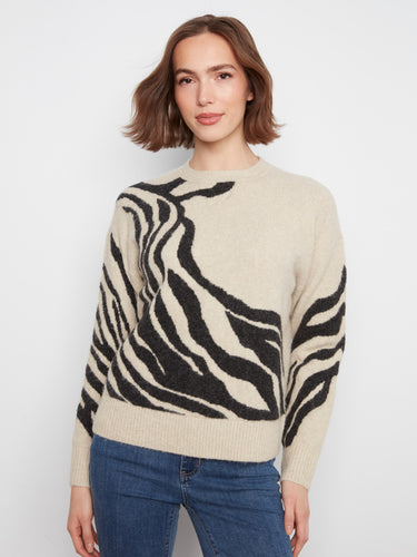 A stylish sweater featuring a classic crew neck, perfect for casual outings or cozy days indoors. By Charlie B.