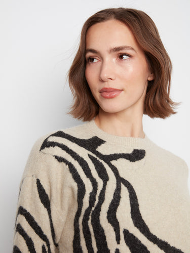 Designed with attention to detail, this sweater combines comfort and style effortlessly with its crew neck. By Charlie B.