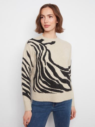 Featuring an eye-catching drop shoulder design, this sweater is ideal for layering during cooler seasons. By Charlie B.