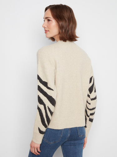 Ribbed cuffs and hem provide the perfect finishing touch to this versatile and comfortable sweater. By Charlie B.