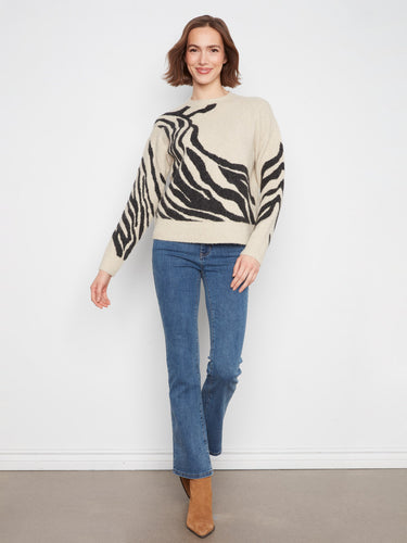 The crew neck adds sophistication to the playful pattern of this warm sweater. By Charlie B.