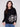 Black sweater showcasing a relaxed fit with intricate jacquard floral design, perfect for stylish comfort by Charlie B.